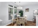 Bright dining area with a modern light fixture and large windows at 609 Atherton Way, Rock Hill, SC 29730