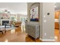 Inviting open-concept living space featuring hardwood floors, stylish decor, and access to other rooms at 6619 Hermsley Rd, Charlotte, NC 28278