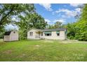 Charming single-story home with a front porch and well-maintained lawn at 8334 Oaktree Rd, Sharon, SC 29742