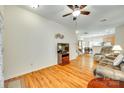 Bright living room boasts hardwood flooring and an open floorplan concept with the kitchen and dining area at 1003 Silver Spring Rd, Fort Mill, SC 29715