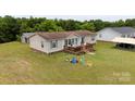 Quaint single-Gathering house featuring a lovely front porch and ample green space at 1007 W Cabaniss Rd, Shelby, NC 28150