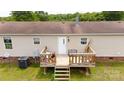 Outdoor deck with stairs and a railing, offering a private backyard view at 1007 W Cabaniss Rd, Shelby, NC 28150