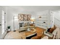 Cozy living room with a decorative bookshelf and a jute rug at 1035 Wexford Nw Pl, Concord, NC 28027