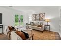 Bright living room featuring a neutral color palette and stylish decor at 1035 Wexford Nw Pl, Concord, NC 28027