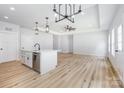 Well-lit kitchen with stainless steel appliances and a center island sink at 120 Autumn Blaze Rd, China Grove, NC 28023