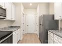 Well-equipped kitchen with stainless steel appliances, granite counters, and ample cabinet space at 1522 Doran Ter, Richburg, SC 29729