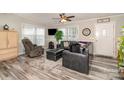Cozy living room with comfortable seating, a ceiling fan, and a view of the front yard at 161 Badin Lake Cir, New London, NC 28127