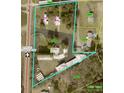Aerial view of property outline showing two houses on one lot and another set of buildings on another, alongside SNC 16 at 1733 S Nc 16 Business Hwy, Stanley, NC 28164