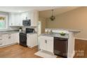 Updated kitchen featuring granite countertops and stainless steel appliances at 2015 Downey St, Rock Hill, SC 29732