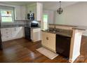 Updated kitchen featuring stainless steel appliances, granite countertops, and hardwood floors at 2015 Downey St, Rock Hill, SC 29732