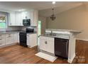 Open kitchen with stainless appliances, granite counters, and breakfast bar for casual dining at 2015 Downey St, Rock Hill, SC 29732