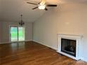 Inviting living room features hardwood floors, fireplace, and sliding doors leading to the deck at 2015 Downey St, Rock Hill, SC 29732