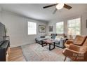 Bright and cozy living room with hardwood floors and a comfortable seating area at 203 Lincoln St, Belmont, NC 28012