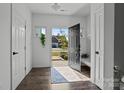 Welcoming foyer featuring hardwood floors, bright natural light, and access to multiple rooms at 3127 Pinehills Way, Mount Holly, NC 28120