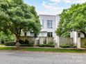 Modern home exterior surrounded by lush greenery and mature trees, creating a serene setting at 314 Viburnum Way Ct, Charlotte, NC 28208