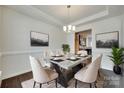 Elegant dining room featuring modern chandelier, stylish table setting, and neutral decor creating a welcoming ambiance at 4051 Whittier Ln, Fort Mill, SC 29708