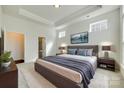 Serene bedroom with tray ceiling, soft lighting, and a luxurious bed offers a relaxing retreat at 4051 Whittier Ln, Fort Mill, SC 29708