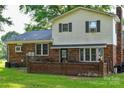 This home's backyard features a brick patio area perfect for outdoor dining and entertaining at 7448 Forney Hill Rd, Denver, NC 28037