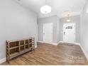 Bright entryway with hardwood floors and neutral paint at 813 Montreat Dr, Dallas, NC 28034