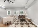 Spacious living room with tray ceiling and lots of natural light at 813 Montreat Dr, Dallas, NC 28034