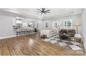 Open-concept living room flowing into the kitchen with bar seating at 813 Montreat Dr, Dallas, NC 28034