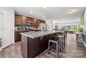 Open-concept kitchen featuring stainless steel appliances, granite countertops, and a view into the living area at 8316 Waxhaw Hwy, Waxhaw, NC 28173