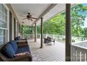 Relaxing covered porch with comfortable seating, perfect for outdoor lounging and enjoying the surrounding views at 832 Kemp Rd, Mooresville, NC 28117