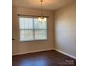 Bright living room featuring wood floors and ample natural light at 9170 Bradstreet Commons Way, Charlotte, NC 28215