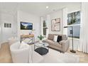 Inviting living room with stylish decor, including modern furniture, sleek lighting, and bright white walls at 1116 4Th St, Statesville, NC 28677