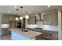 Beautiful kitchen featuring stainless steel appliances, island, and modern cabinetry at 113 Tonbridge Way # Haf0031, Mooresville, NC 28115