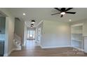 Bright living room featuring hardwood floors, recessed lighting, and built in bookshelves at 113 Tonbridge Way # Haf0031, Mooresville, NC 28115