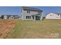 Large backyard with a covered patio and ample green space, perfect for outdoor activities and relaxation at 119 Tonbridge Way # Haf0033, Mooresville, NC 28115