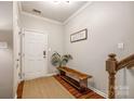 The inviting foyer features wood floors, a bench, and a door leading to the rest of the home at 1206 Craig Ave, Lancaster, SC 29720