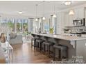 Bright kitchen with a large island, stainless steel appliances, and an open floor plan at 1216 Links Crossing Dr # 159, Monroe, NC 28112