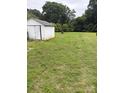 Expansive backyard with a storage shed and plenty of green space, perfect for outdoor activities at 1292 Longview Rd, Rock Hill, SC 29732