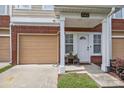 Inviting front entrance features a covered porch with garage and tidy landscaping at 15432 Coventry Court Ln, Charlotte, NC 28277