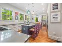 Bright, modern kitchen with stainless appliances, large island, and colorful accents at 1801 E 8Th St, Charlotte, NC 28204