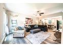 Inviting living room featuring an open layout, wood-look floors, a large sectional sofa and a view of the kitchen at 2045 13Th Ne St # 3, Hickory, NC 28601
