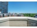 Apartment complex featuring a terrace view with high rise and city in the distance at 300 W 5Th St # 812, Charlotte, NC 28202