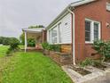Close up view of a brick home exterior with large windows and front porch at 3055 16Th Ne St, Hickory, NC 28601