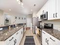 Stylish kitchen featuring granite countertops, tile flooring and stainless steel appliances at 3248 Margellina Dr, Charlotte, NC 28210