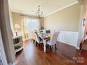 Elegant dining room with hardwood floors and stylish chandelier at 3416 Yarmouth Ln, Gastonia, NC 28056