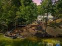 Scenic waterfront home with private dock offering serene views and direct lake access at 402 Wildlife Rd, Troutman, NC 28166