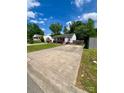 Charming single-story home featuring a large driveway and well-maintained landscaping, perfect for suburban living at 6000 Amberly Ln, Charlotte, NC 28213