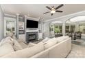 Bright living room with fireplace, built-in shelving, bay window, and comfortable seating at 6419 Antioch Ct, Matthews, NC 28104