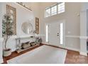 Bright foyer with hardwood floors, a console table, and a view of the staircase at 645 Brookhaven Dr, Fort Mill, SC 29708