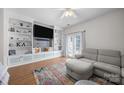 Bright living room with custom built-ins and shelving and a comfortable seating arrangement at 740 Tavern Ct # 7, Rock Hill, SC 29732