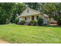 Inviting home exterior with landscaped front yard and charming porch at 7660 Bud Davis Rd, Vale, NC 28168