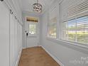 Bright entryway featuring hardwood floors, beadboard paneling, and natural light at 809 Ayrshire Ave, Fort Mill, SC 29708