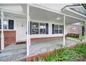 Charming front porch with a swing, offers an inviting entrance to the home with well-maintained landscaping at 842 Cherry S Rd, Rock Hill, SC 29732
